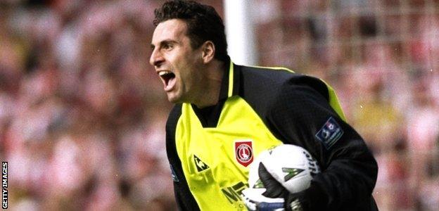 Charlton keeper Sasa Ilic races out of his goal after saving Michael Gray's penalty