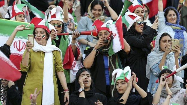 Iranian women watch their men play Cambodia