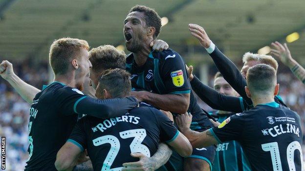 Wayne Routledge celebrates