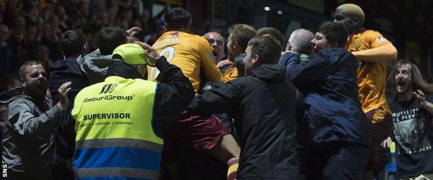 Players and fans celebrate Motherwell's winner