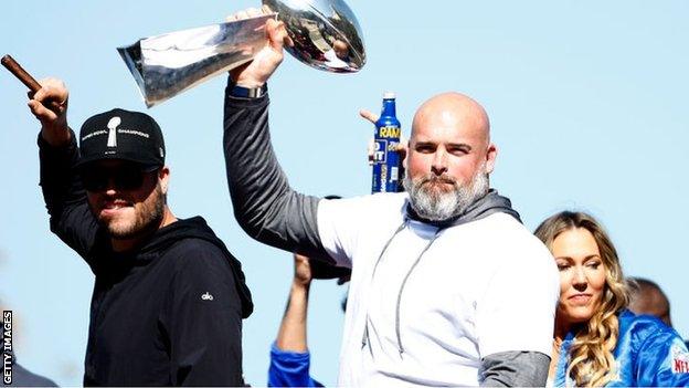 Matthew Stafford and Andrew celebrate with the Lombardi trophy