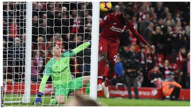 Origi heads the ball past Jordan Pickford, 2018.