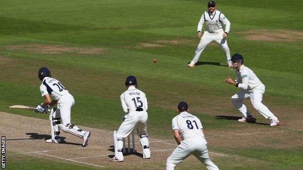 Middlesex wicketkeeper John Simpson was the second of Josh Poysden's five victims, caught at short leg by Sam Hain