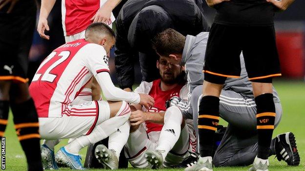 Daley Blind on the pitch after suffering from dizziness