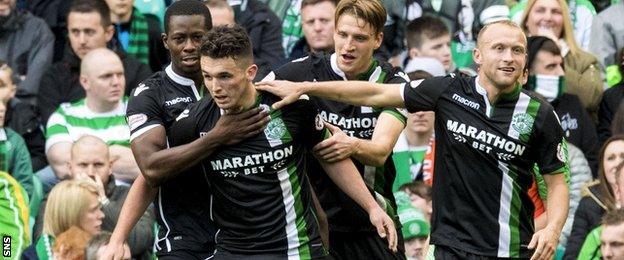 John McGinn receives the congratulations of his Hibs team-mates after scoring against Celtic