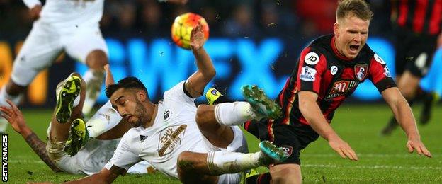 Neil Taylor tackles Matt Richie