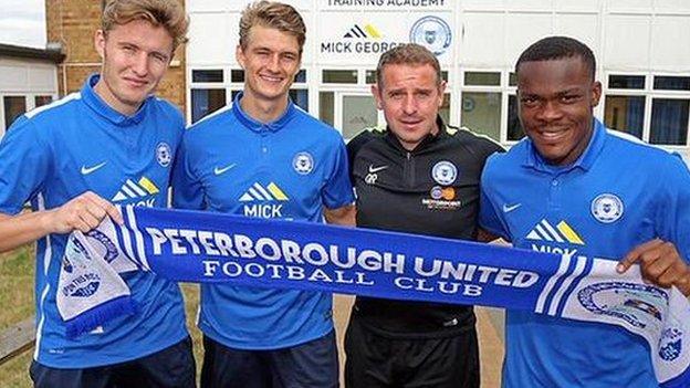 From left: Keiran Sadlier, Andrew Fox, PUFC manager Dave Robertson, Souleymane Coulibaly.