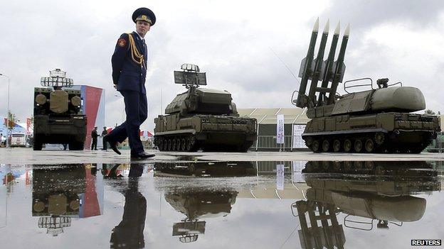 A Russian serviceman walks past the Buk-1M missile system at the Army-2015 international military forum in Kubinka, outside Moscow, Russia, on 16 June 2015