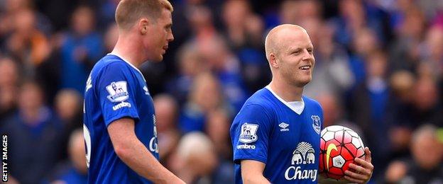 Steven Naismith walks off with the match ball after his hat-trick against Chelsea at Goodison