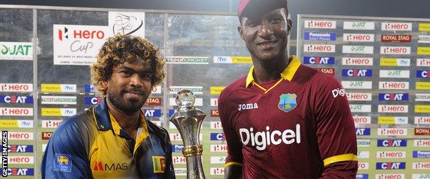 Captains Lasith Malinga and Jason Holder with the T20 series trophy