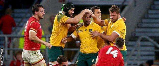 Australia players celebrating in the victory over Wales