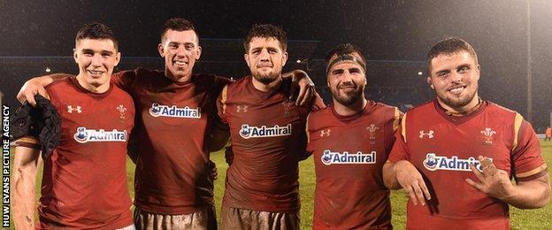 Wales players celebrate beating Samoa