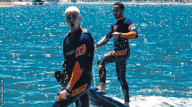 Lewis Hamilton and Justin Bieber surfing