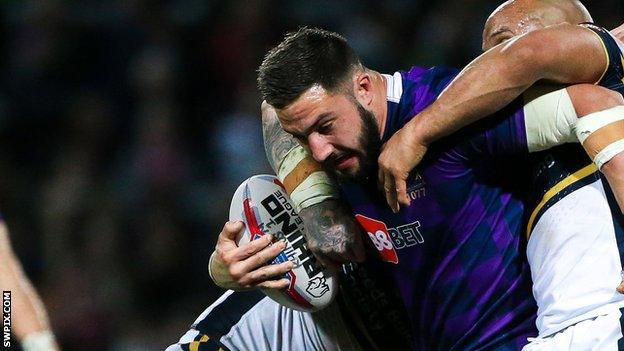 Wigan's Romain Navarrete tries to bust through a tackle