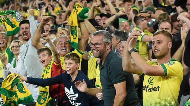 Norwich fans celebrate at Carrow Road