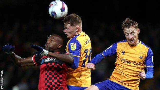 Hartlepool remain in the relegation places despite fighting back for a point against Mansfield