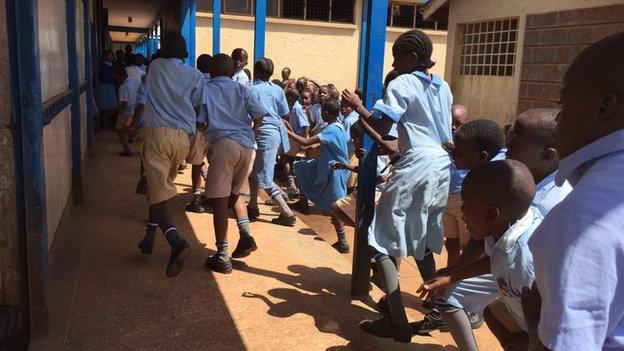 Pupils running to class