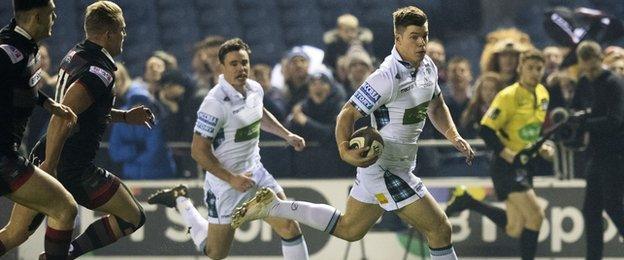 Huw Jones runs in the opening try for Glasgow Warriors