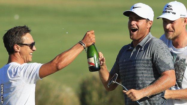 Portugal Masters winner Lucas Bjerregaard (right) celebrates with some champagne