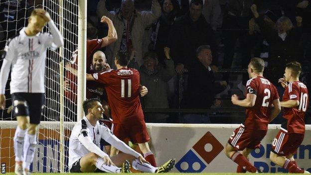 Ayr celebrate their late winner as Falkirk players look distraught