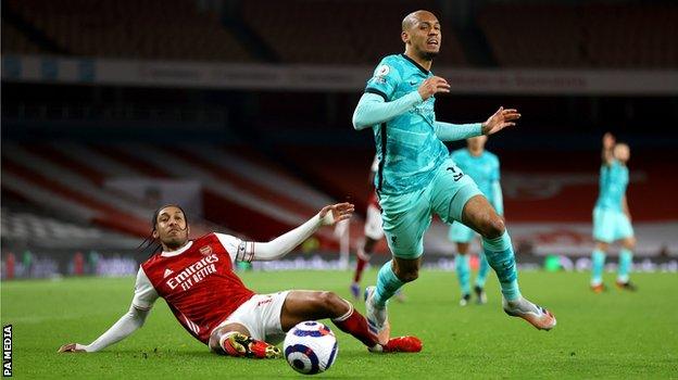 Fabinho (r) challenges Pierre-Emerick Aubameyang. He made six tackles in Saturday's win over Arsenal, twice as many as any other Liverpool player