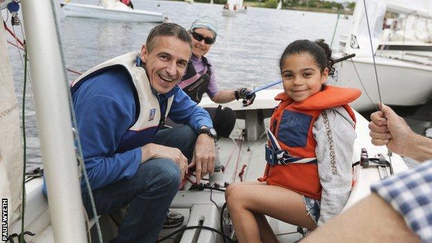 A family enjoying sailing