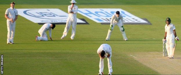 Ian Bell reacts after dropping Asad Shafiq