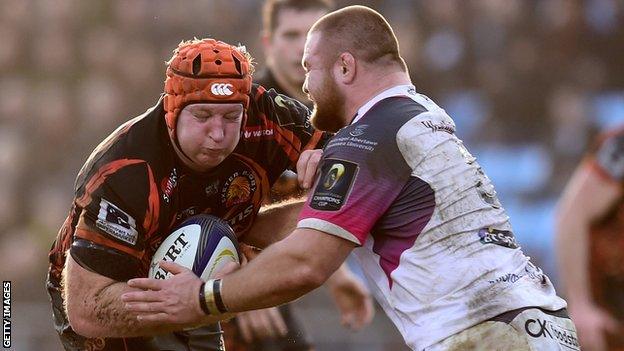 Thomas Waldrom (left) makes a break for Exeter against Ospreys