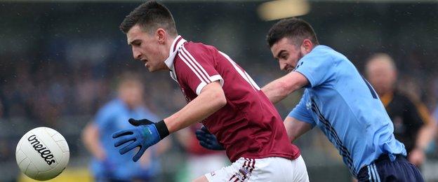 Slaughtneil goalscorer Meehaul McGrath is challenged by Killyclogher's Danny Gorman at the Athletic Grounds