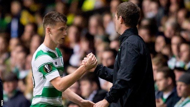 Celtic's Kieran Tierney is congratulated by manager Ronny Deila