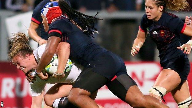 Sarah Bern drives forwards despite the tackle of powerhouse France number eight Safi N'Diaye