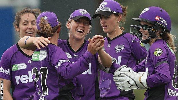 England captain Heather Knight (centre) celebrates a catch for Hobart Hurricanes