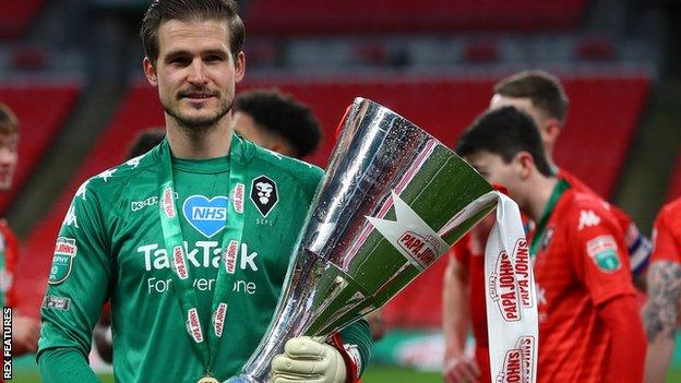 Vaclav Hladky with the EFL Trophy after Salford City beat Portsmouth