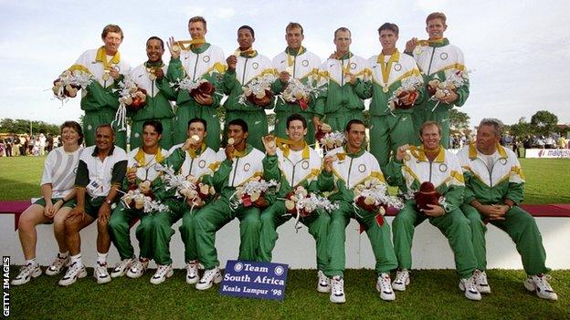 South Africa's players show off their gold medals after a four-wicket win over Australia