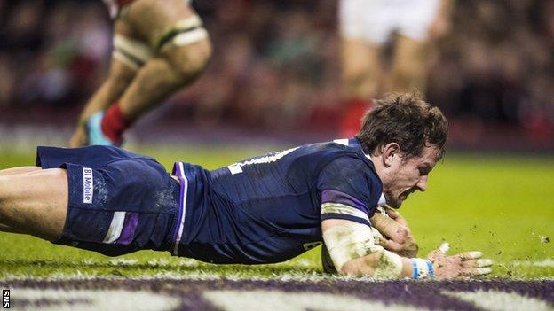 Scotland centre Peter Horne scores against Wales