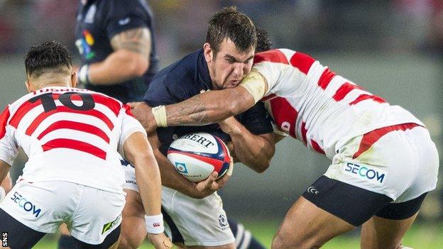 Scotland's Stuart McInally is held up by Japan