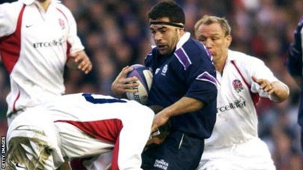 Budge Pountney is tackled playing for Scotland against England in 2002