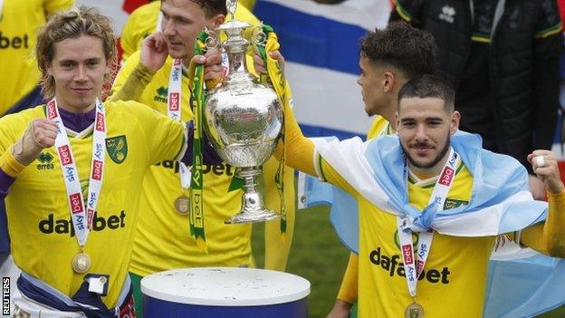 Norwich players Todd Cantwell and Emiliano Buendia with the Championship trophy