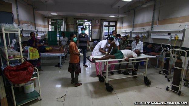 Victims of toxic alcohol receive treatment inside a Mumbai hospital