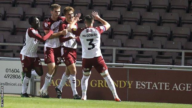 Josh Tomlinson of Northampton Town celebrates after scoring his sides first goal