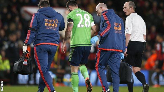 Southampton striker Charlie Austin limps off at Bournemouth