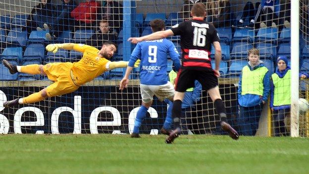 Glenavon keeper Jonathan Tuffey dives in vain as Coleraine striker Jamie McGonigle finds the bottom corner