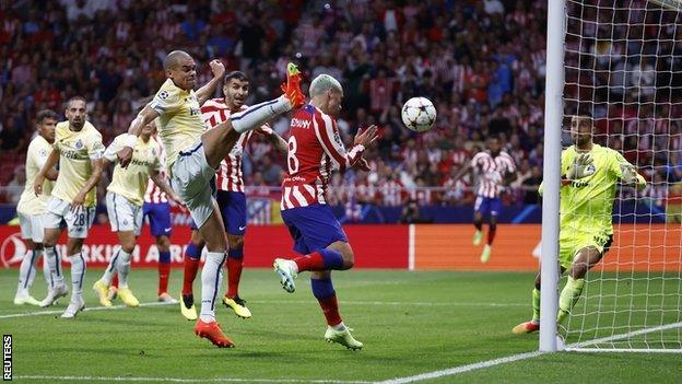 Atletico Madrid's Antoine Griezmann scores their second goal against Porto