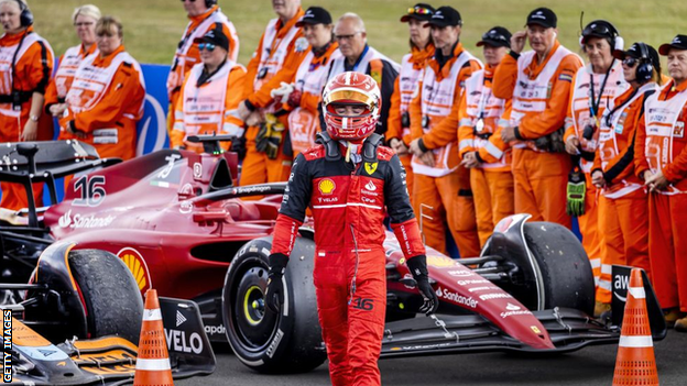 Charles Leclerc walks away from his car at Silverstone