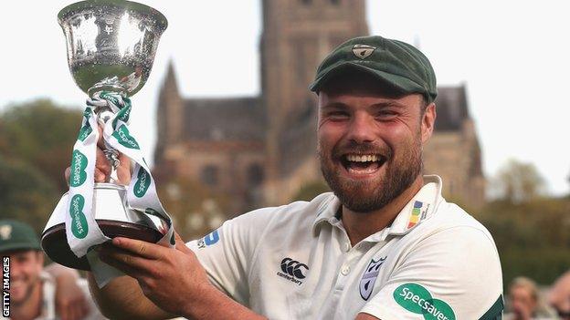 Joe Leach lifts the County Championship Division Two trophy in 2017