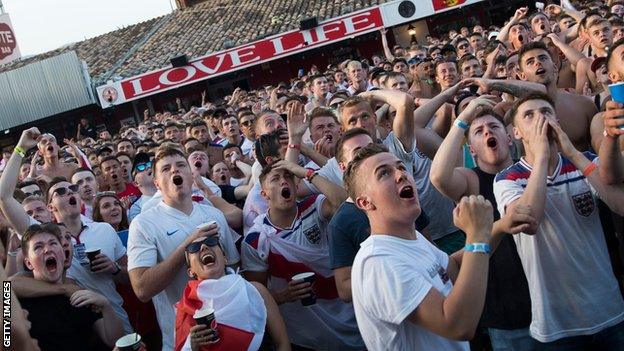 England supporters react as they watch the Russia 2018 World Cup semi-final football match between Croatia and England at a holiday resort of Magaluf