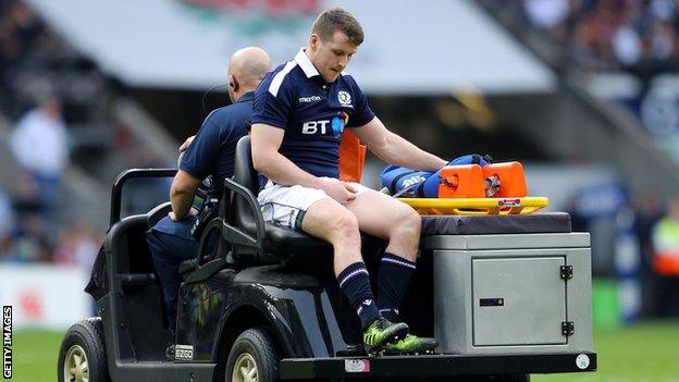 Mark Bennett leaves the pitch injured during the 2017 Six Nations match against England