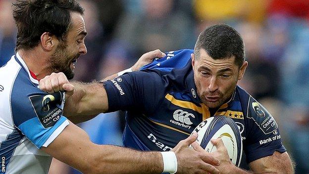 Leinster fullback Rob Kearney is tackled by Alex Robert Ebersohn