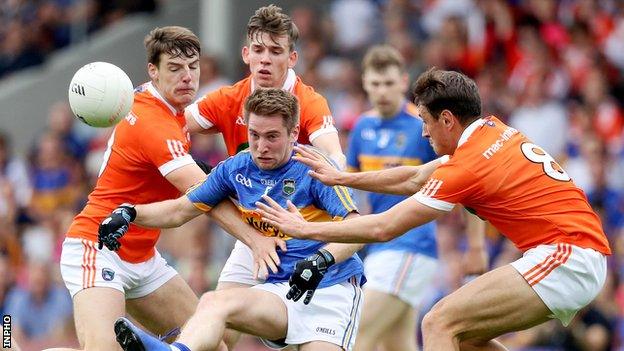 Armagh's Niall Grimley, Mark Shields and Stephen Sheridan surround Tipperary's Bill Maher