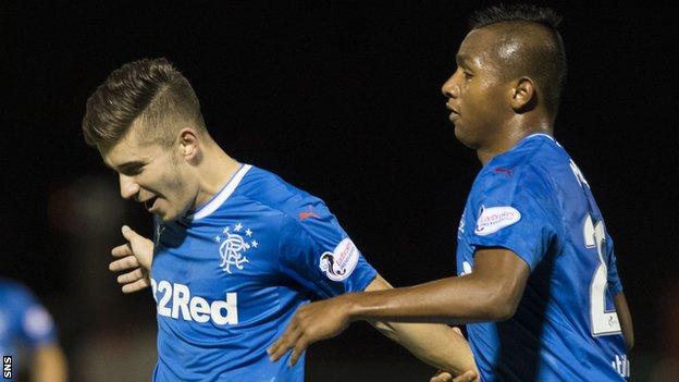 Rangers defender Declan John (left)